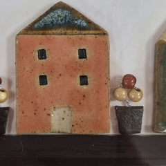 Yvonne Fleming Pottery Houses in Black Frame Medium Daylight