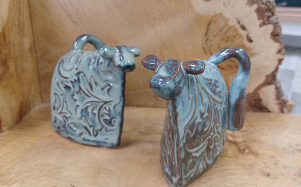 Mount Ida Pottery Gallery. Cow abstract Sculptures