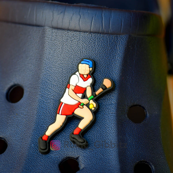Croc Charm Rupic Gibbitz - A hurling player looking for a pass in a Derry style kit